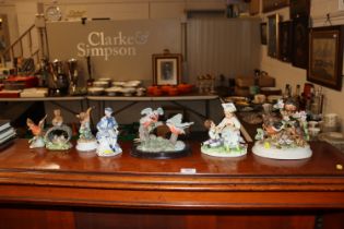 A collection of various porcelain figures includin