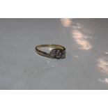 An 18ct gold and platinum diamond three stone ring