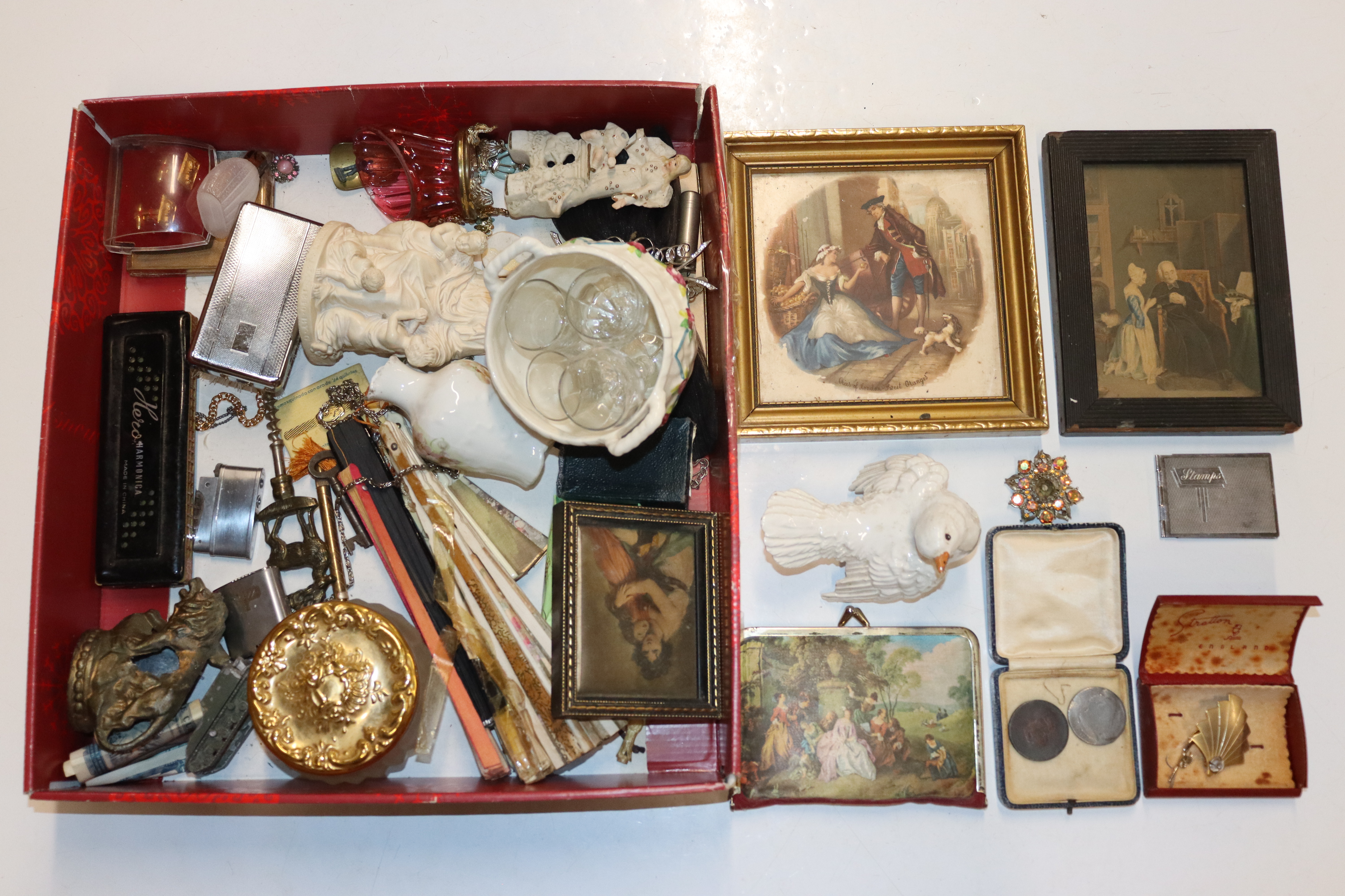 A box containing a gilt framed tile; framed prints