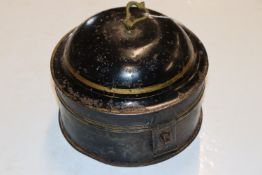 A circular spice box with integral nutmeg grater
