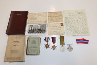 A box containing WWII medals and documents to C.E.