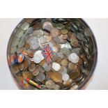 A tin and contents of various coinage