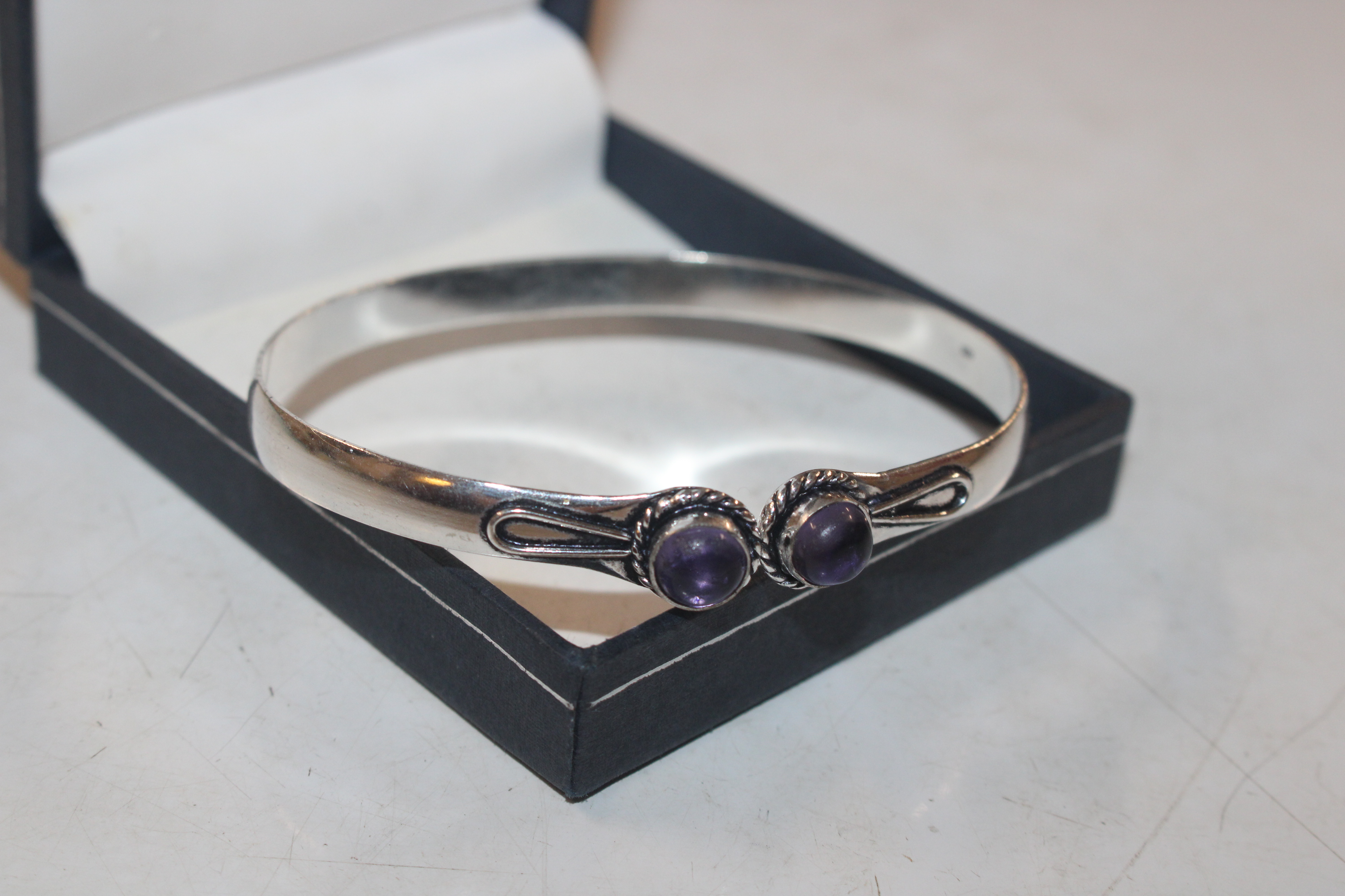 A 925 silver and amethyst set bangle