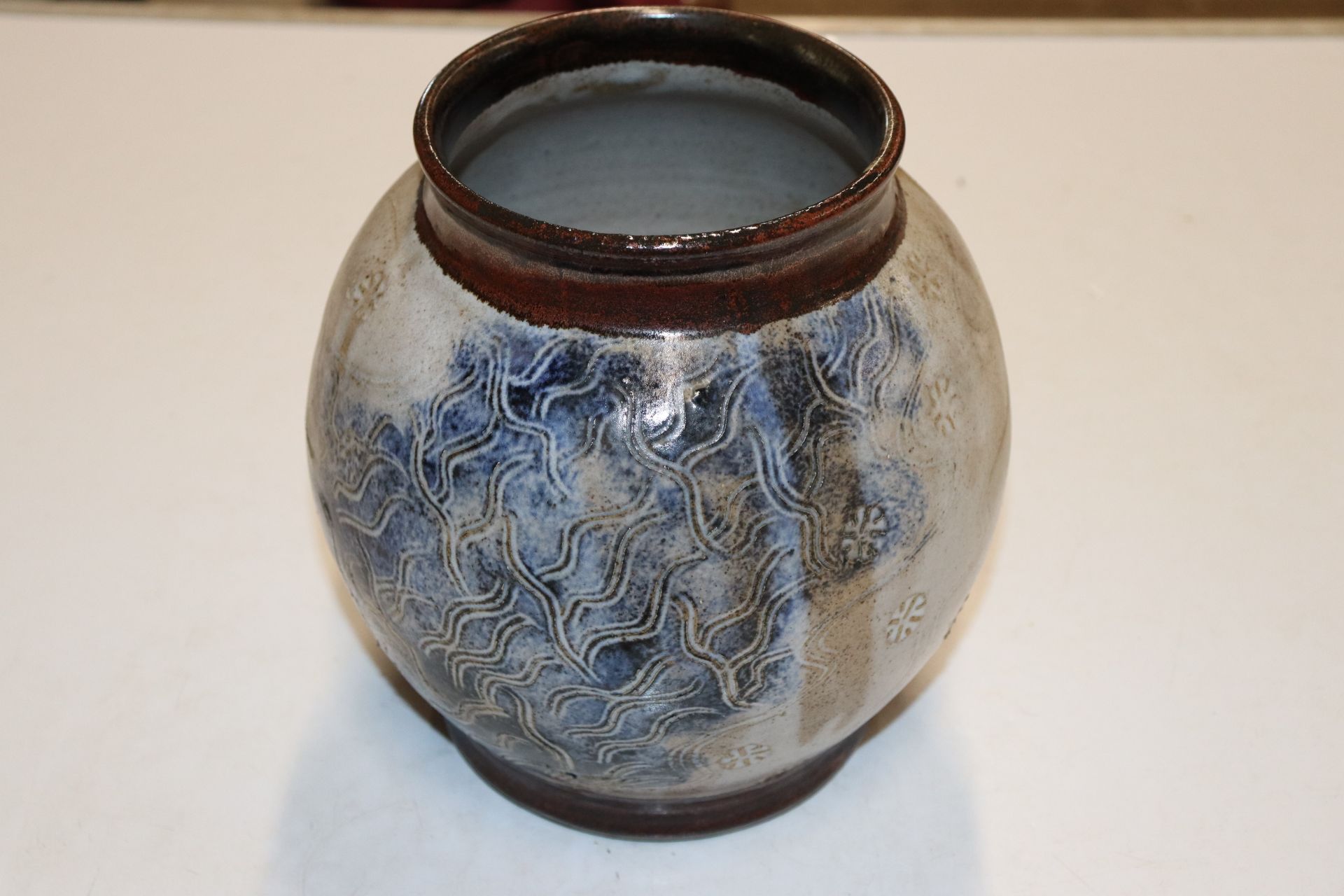 A Studio Pottery baluster vase, having incised flo