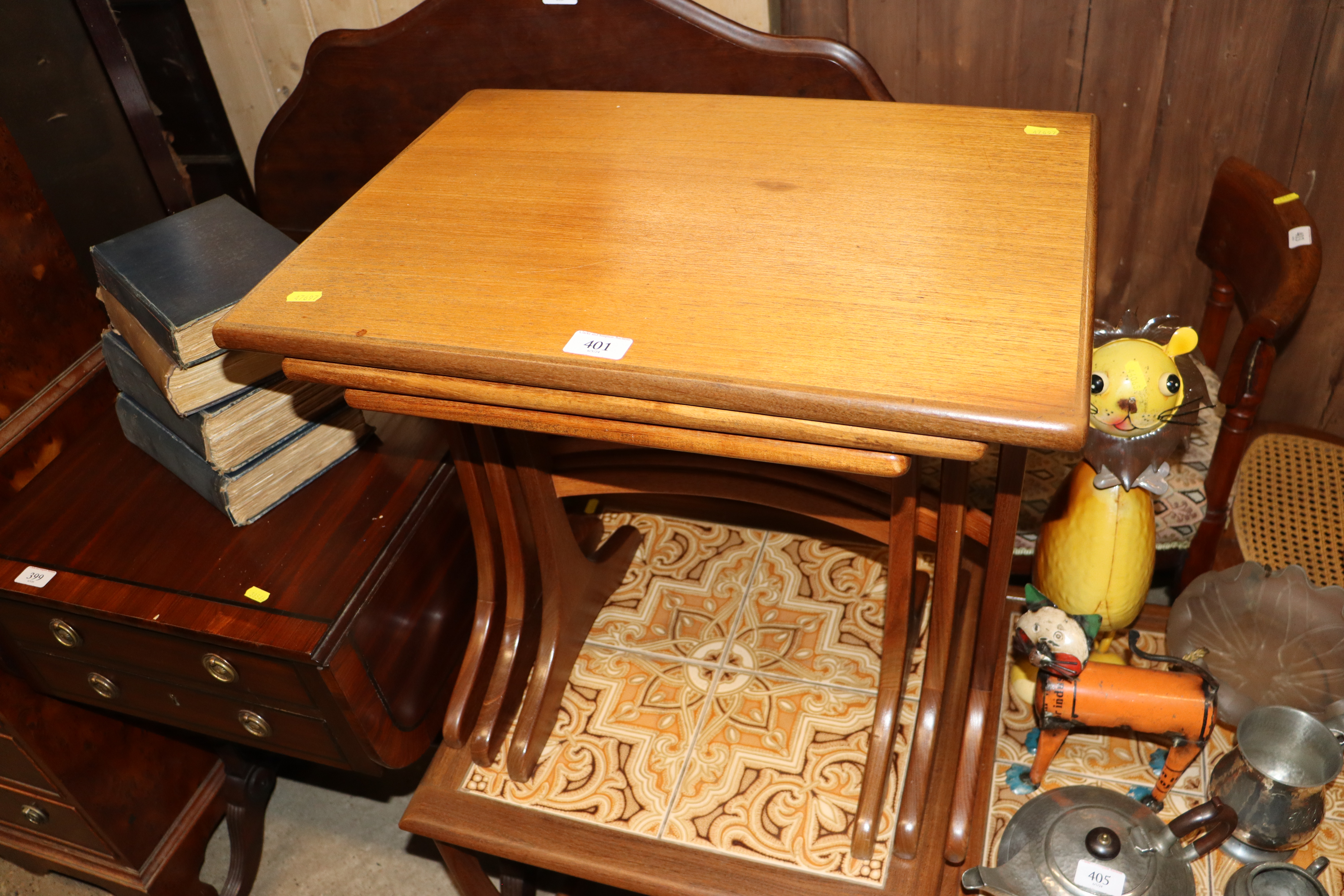 A nest of three teak G-plan occasional tables