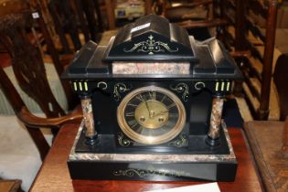 A Victorian slate and marble mantel clock with eig
