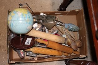 A box containing various vintage kitchenalia and a tin desk globe