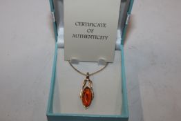 A Sterling silver gilt amber set pendant hung to a