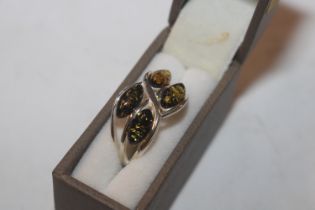 A Sterling silver and green amber set ring, ring s