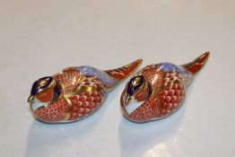 A pair of Royal Crown Derby paperweights in the fo