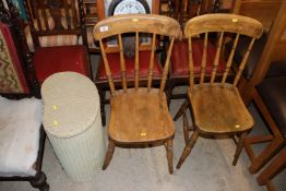 A pair of elm seated and stick back chairs; and a