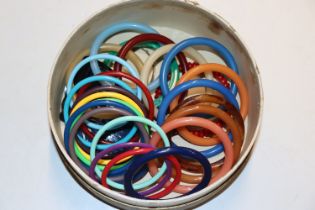 A circular box and contents of 1980's bangles