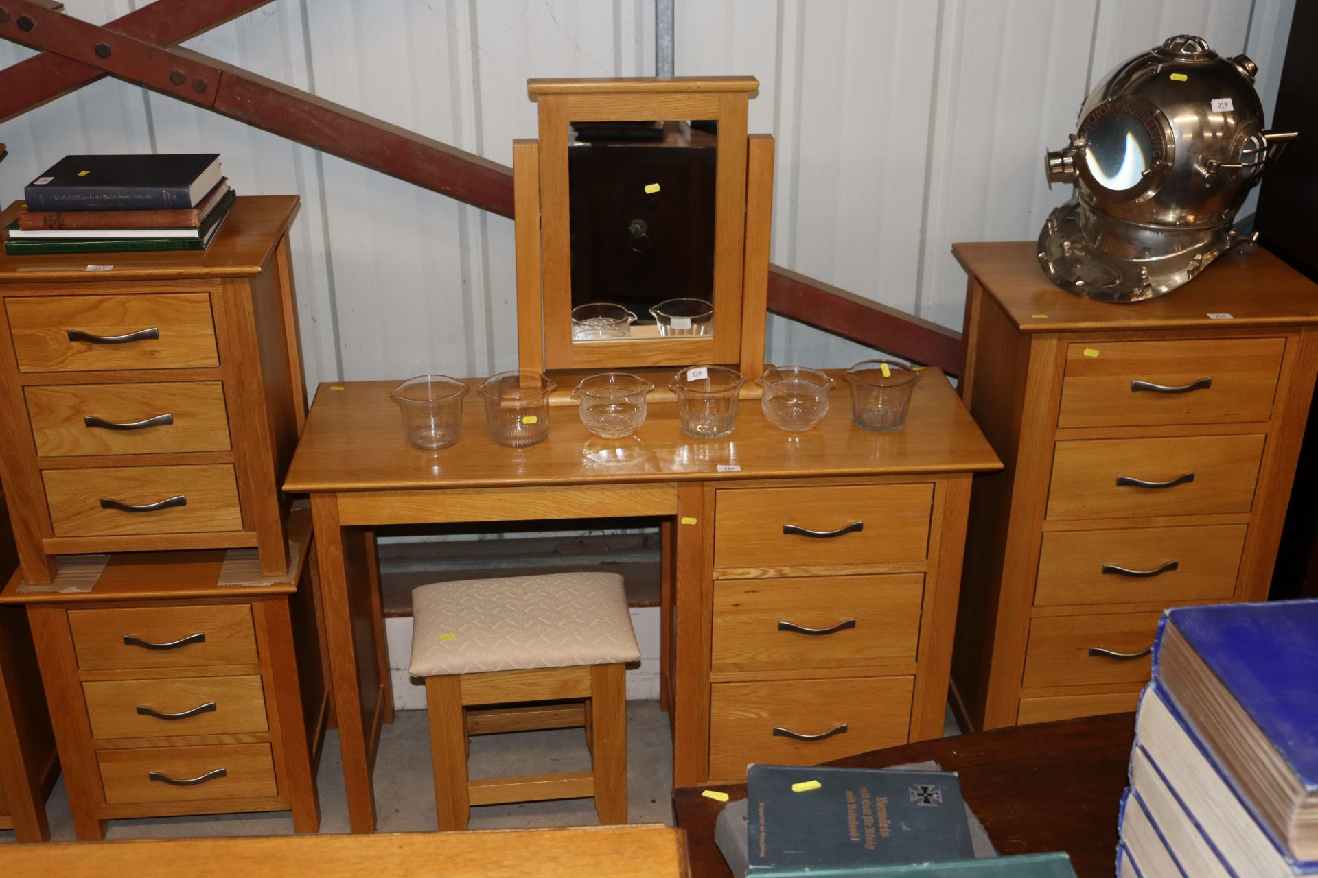 A light oak dressing table with fitted three drawe