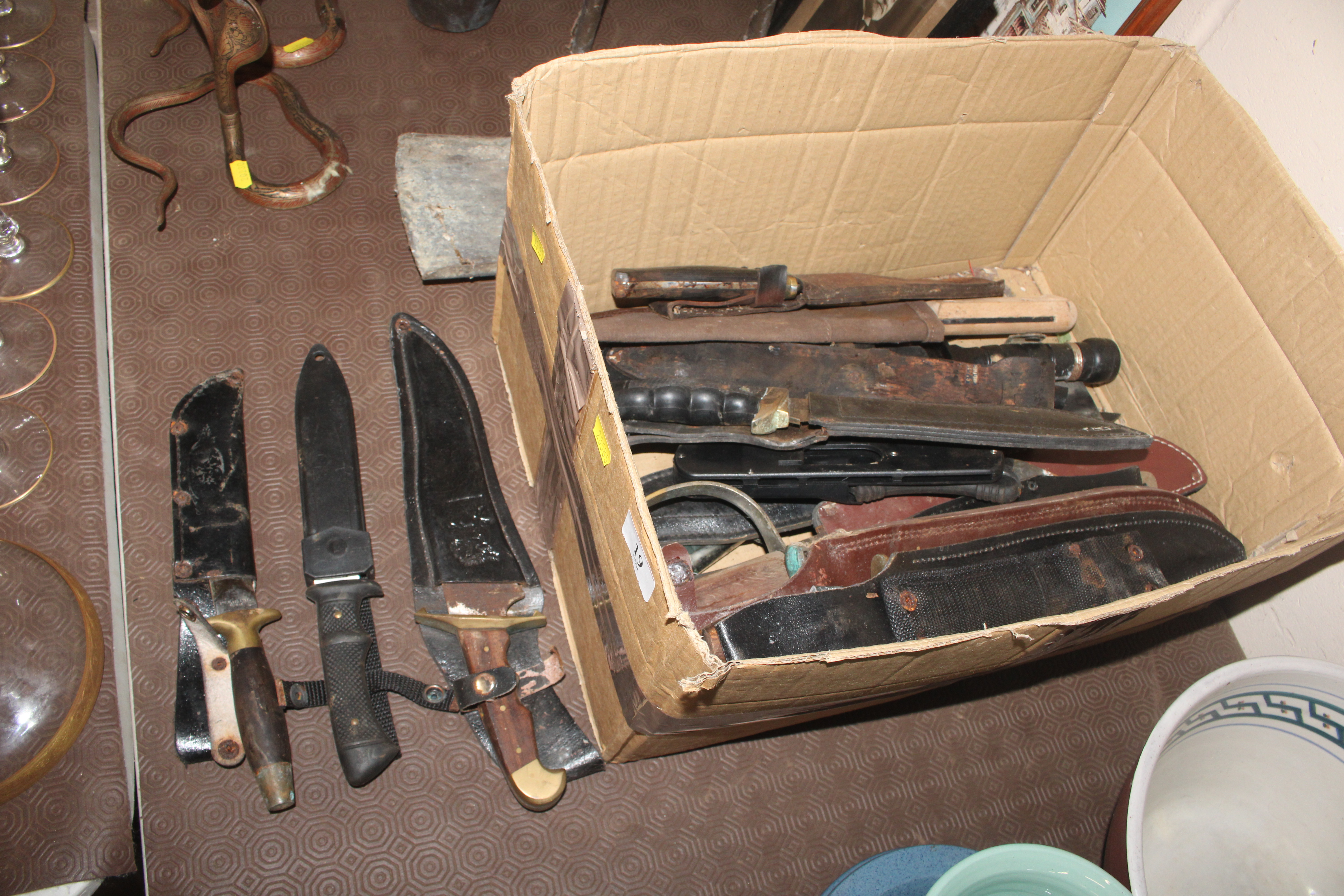 A box of various mixed knives