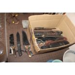 A box of various mixed knives