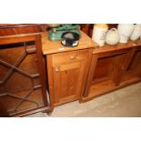 A pine cupboard fitted single drawer