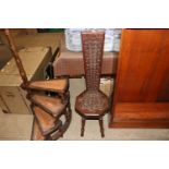 An antique carved oak Welsh spinning chair