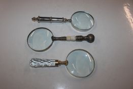 Three magnifying glasses