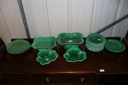 A quantity of Wedgwood and other green glazed leaf