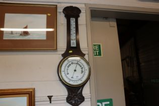 A carved oak cased banjo barometer / thermometer
