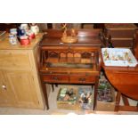 An Edwardian mahogany roll top desk