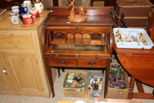 An Edwardian mahogany roll top desk