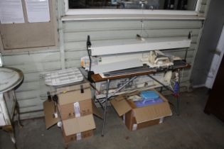 A Brother knitting machine and various accessories