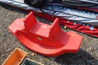 A child's two seater plastic see-saw/rocker