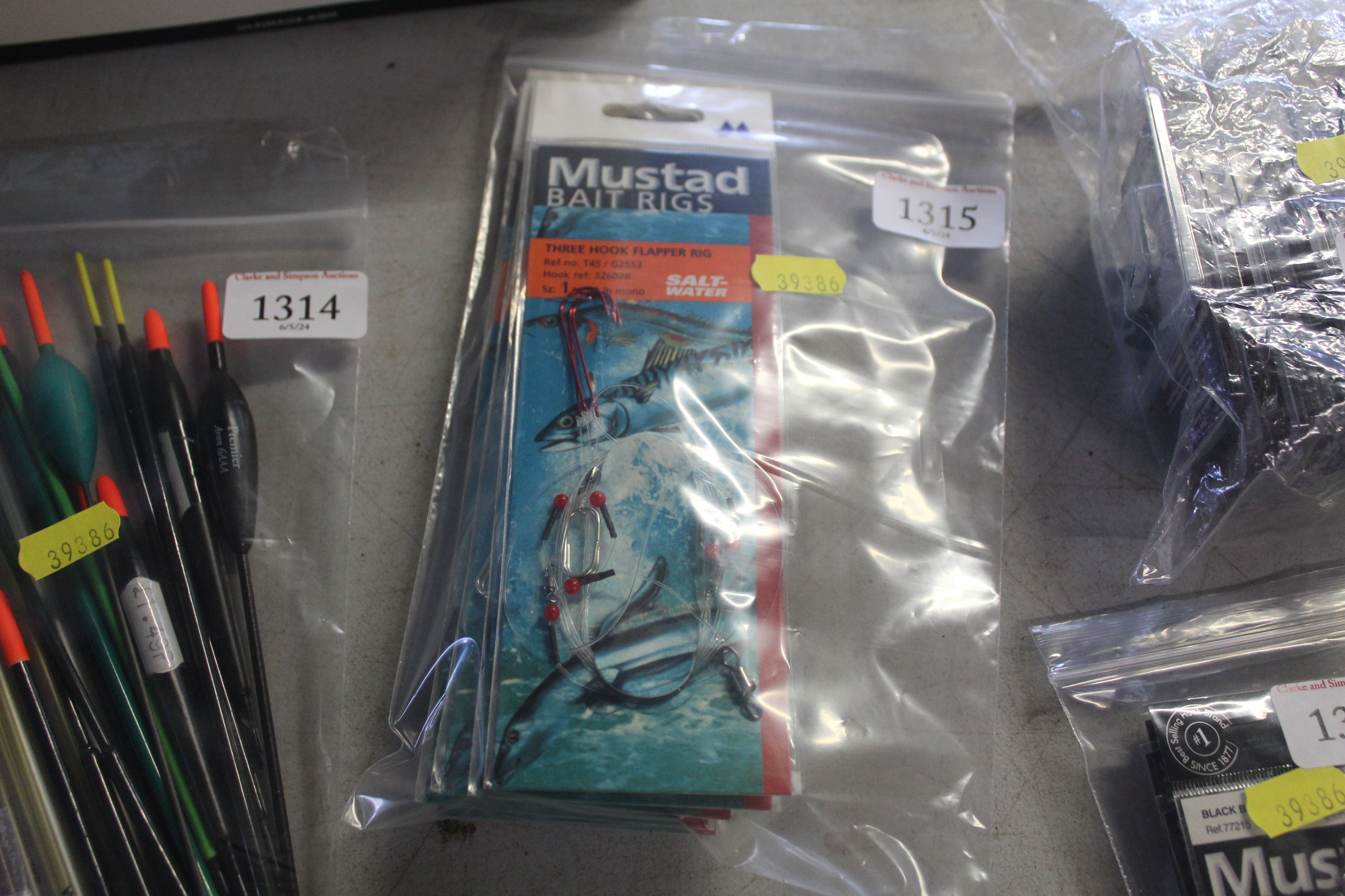 A quantity of Mustad flapper rigs