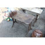 A wooden topped cast iron work bench fitted Record