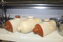 Three stoneware hot water bottles