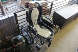 A Karma folding self propelled wheelchair