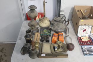 A collection of metalware to include brass hand be