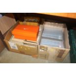 Two boxes containing various albums of cigarette c