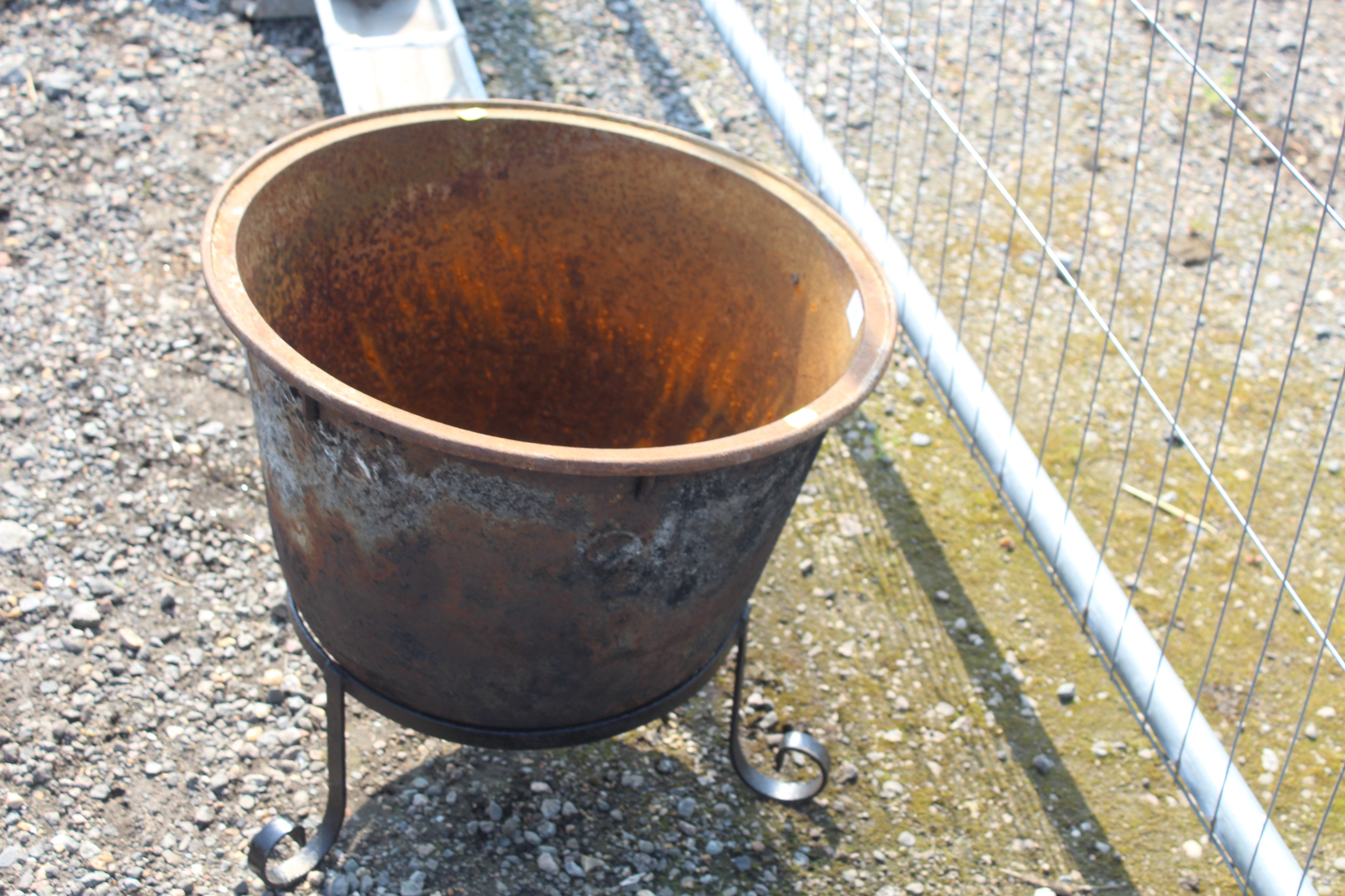 A circular cast iron cauldron on wrought metal sta - Image 2 of 2