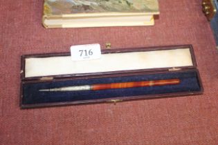 An agate and white metal pencil in case