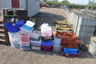 A quantity of plastic storage boxes