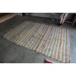 An approx. 10' x 6'8" rag rug