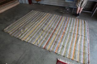 An approx. 10' x 6'8" rag rug