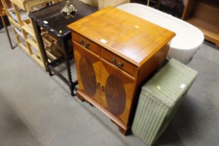 A reproduction yew wood hi-fi cabinet