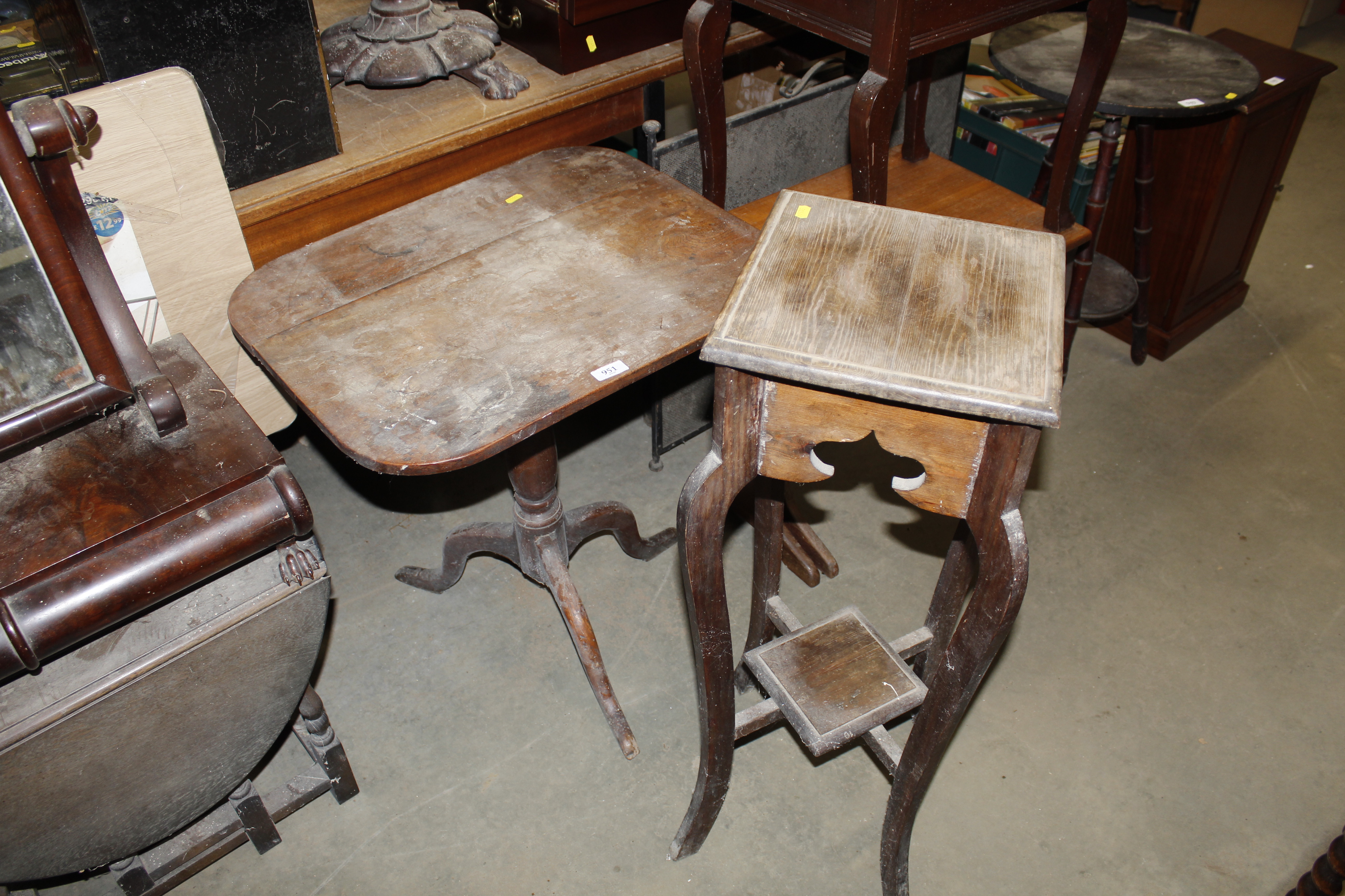 A plant stand and a table raised on tripod plates