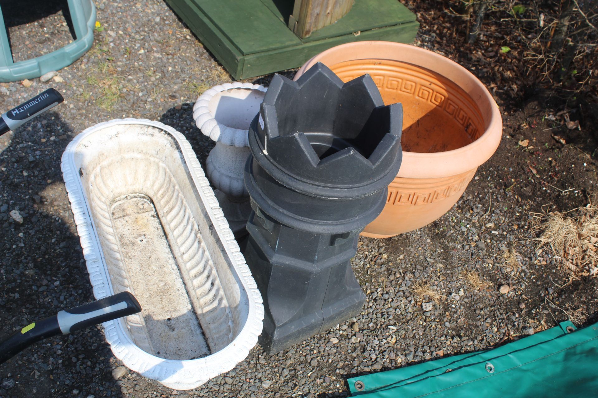 A quantity of plastic planters, plant troughs and