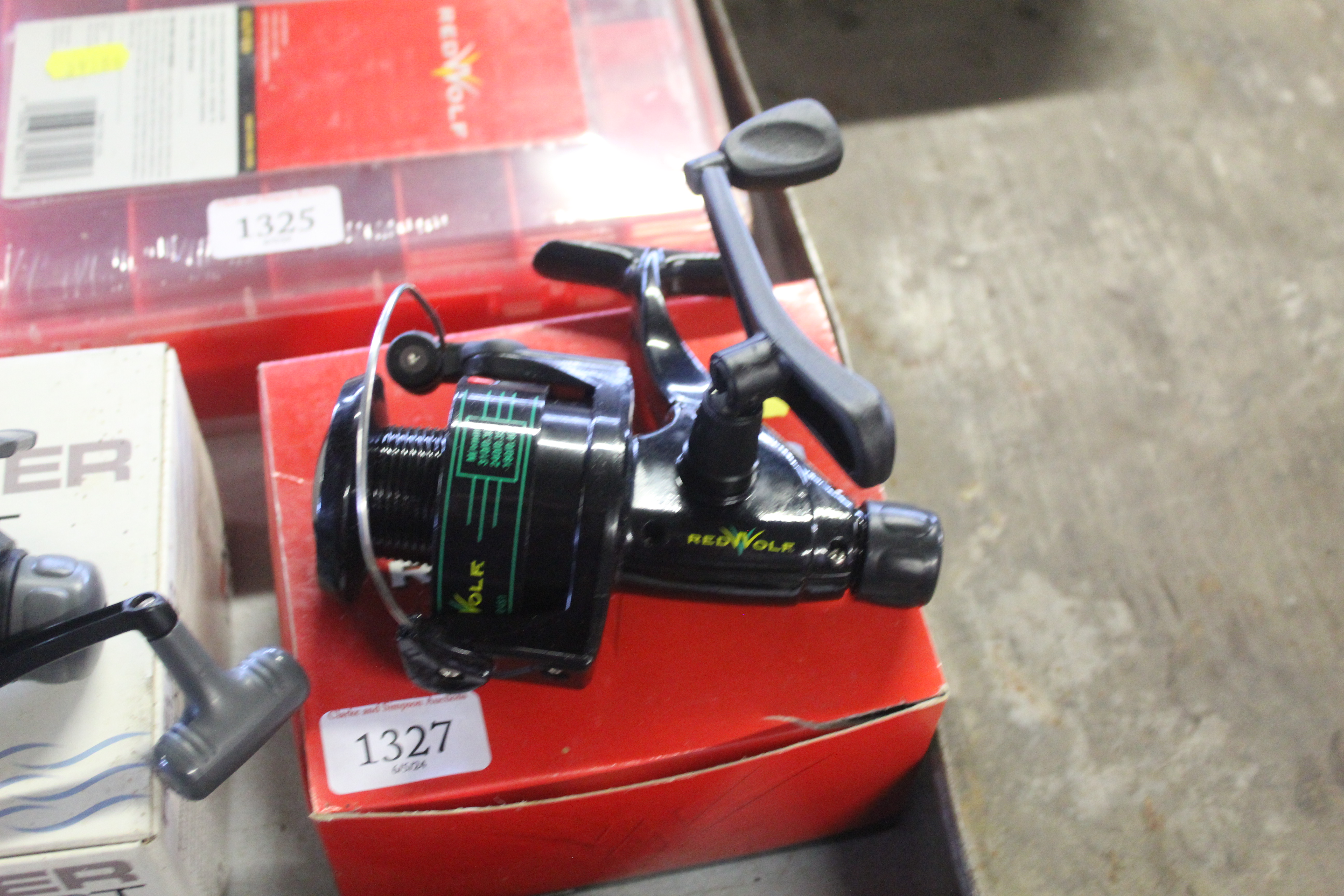 A Red Wolf RW210S5R spinning reel with original bo
