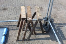 Three wooden three legged trestle stands