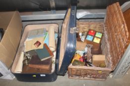 A wicker basket and a case containing various book