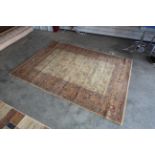 An approx. 7'9" x 5'7" floral patterned rug