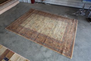 An approx. 7'9" x 5'7" floral patterned rug