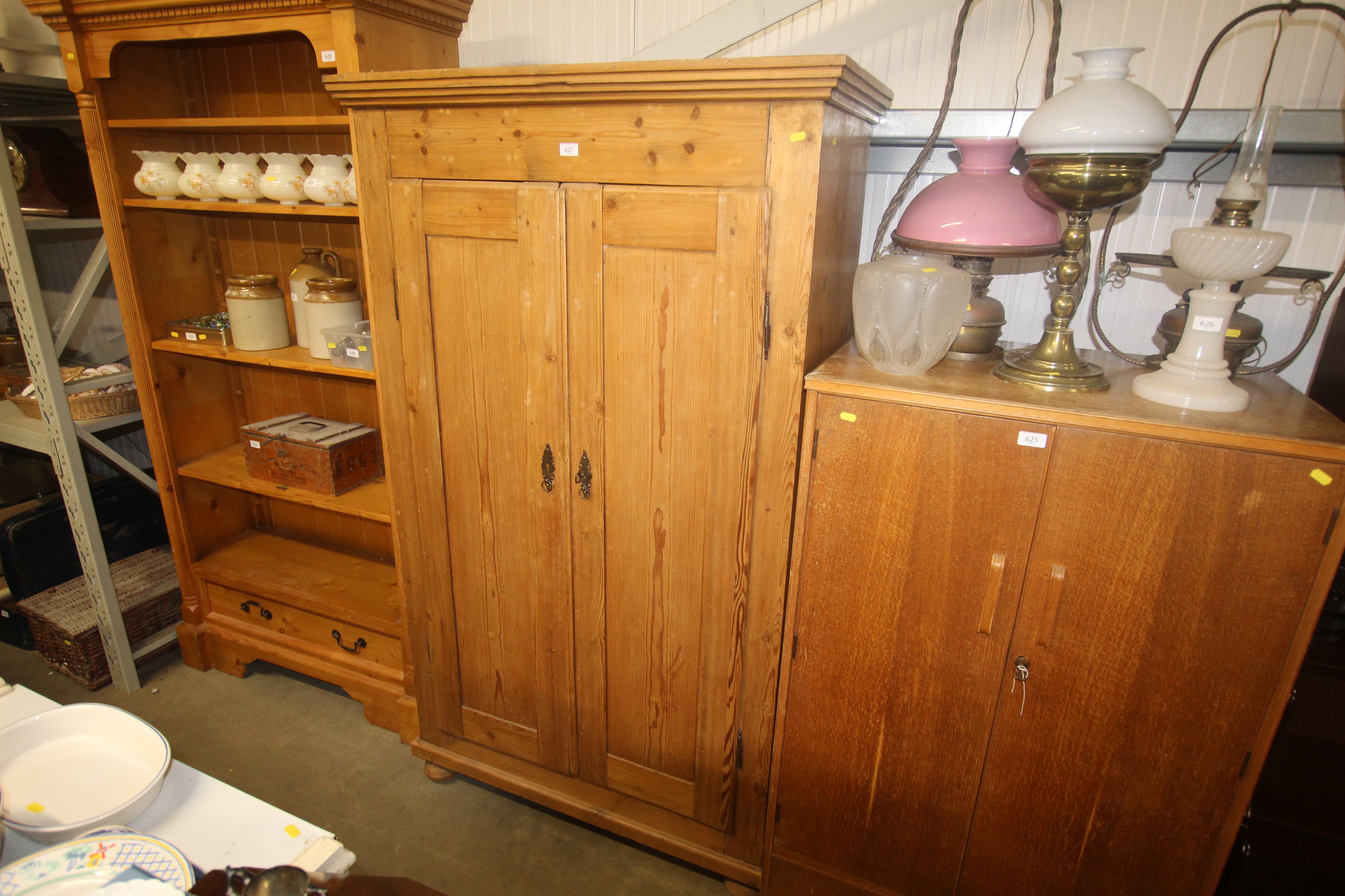 A stripped pine two door wardrobe