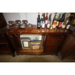 A reproduction mahogany bookcase with adjustable s