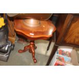 An inlaid occasional table raised on tripod base